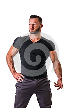 Handsome muscular man standing, isolated