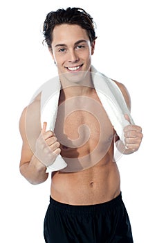 Handsome muscular man with the towel