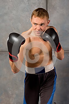 Handsome muscular young boxer