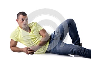 Handsome, muscular young man lying on the floor