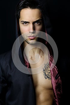 Handsome mysterious man with a tattoo photo