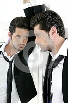 Handsome narcissistic young man in a mirror