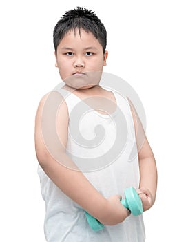 Handsome obese boy is doing exercises with dumbbells