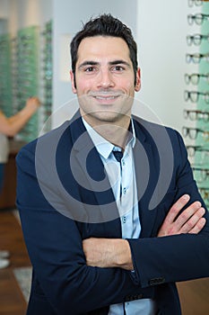 handsome optician looking at camera
