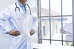 Handsome portrait man of mature doctor with white coat and stethoscope