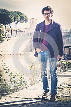 Handsome portrait man outdoor. Model hair and clothing style.