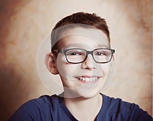 Handsome preteen boy with correction myopia glasses photo