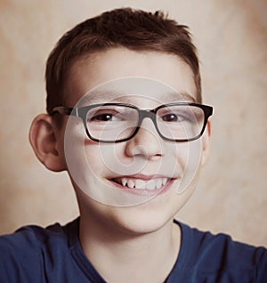 Preteen boy with correction myopia glasses