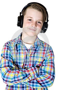 Handsome preteen boy smiling headphones with his arms folded