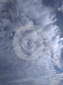 A handsome rare snapshot of a lovely pattern of shining clusters of white clouds