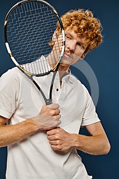 handsome redhead man in white tennis