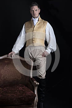 A handsome Regency gentleman wearing a gold waistcoat