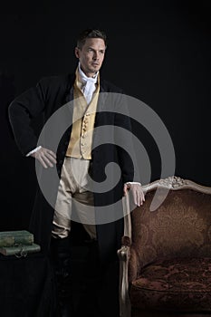 A handsome Regency gentleman wearing a gold waistcoat