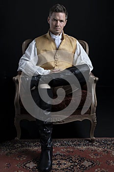 A handsome Regency gentleman wearing a gold waistcoat photo