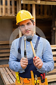 Handsome repairman holding tools