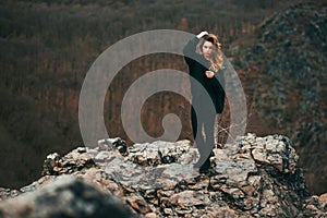 Fashionable young girl with messy hair in sweater outdoor