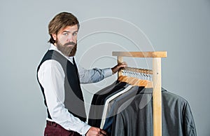 Handsome sartor with tape measure. male beauty and fashion. bearded man tailoring clothes. formal and office wardrobe