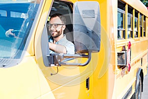 handsome school bus driver smiling