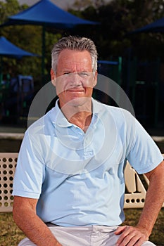 Handsome senior man in a blue shirt