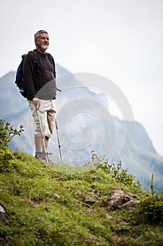 Handsome senior man nordic walking photo