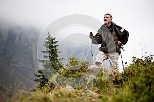 Handsome senior man nordic walking photo