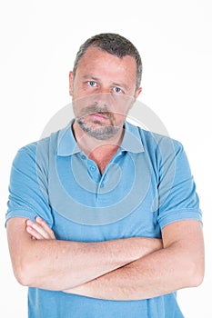 Handsome serious face man portrait arms crossed aside copy space in white background