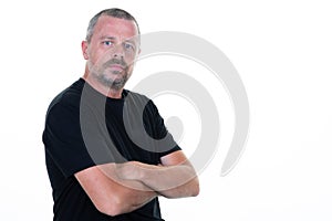 Handsome serious man dressed in casual black shirt aside copy space isolated on white background