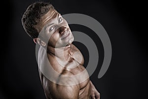 Handsome shirtless bodybuilder shot from above