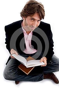 Handsome sitting male with books