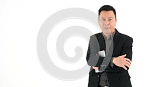 Handsome smiling business man in suit holding mobile device, isolated on white background