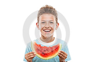 Handsome smiling child boy holding red watermelon fruit slice