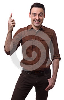 Handsome smiling man pointing upwards