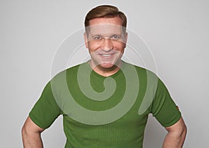 Handsome smiling middle aged man studio portrait