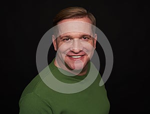 Handsome smiling middle aged man studio portrait