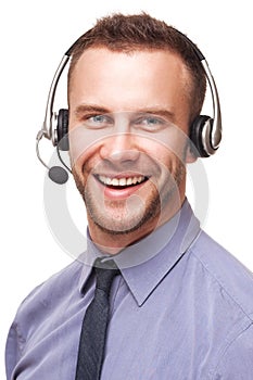 Handsome smiling young businessman using headset