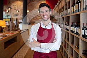 handsome sommelier in wine shop or bar