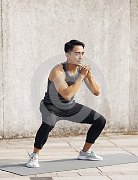 Handsome sportive man doing workout outdoor