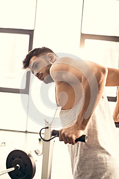 handsome sportsman doing pull ups