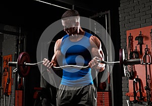 Handsome strong athletic man pumping up muscles, training, bodybuilding concept, muscular bodybuilder, handsome men doing