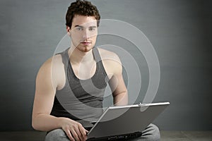 Handsome student young man sit working laptop