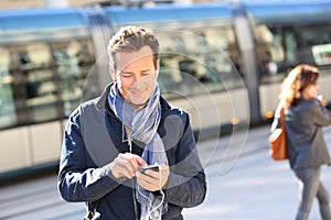 Handsome stylish man in town talking on phone