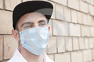 Handsome stylish man wearing medical protective mask