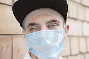 Handsome stylish man wearing medical protective mask