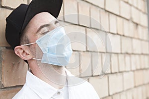 Handsome stylish man wearing medical protective mask