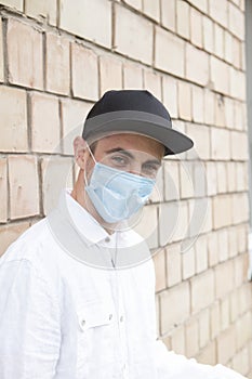 Handsome stylish man wearing medical protective mask