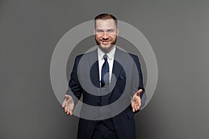 Handsome successful businessman wearing suit and smiling