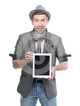 Handsome surprised man in hat with digital tablet pc.