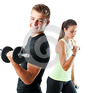 Handsome teen couple working out with weights.