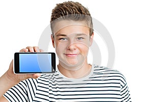 Handsome teen showing smart phone with blank screen.