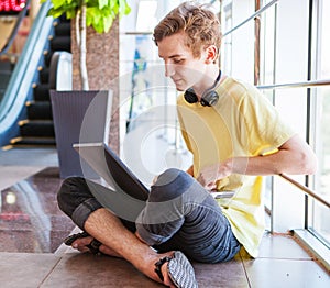 Handsome teenage boy using wifi internet connect